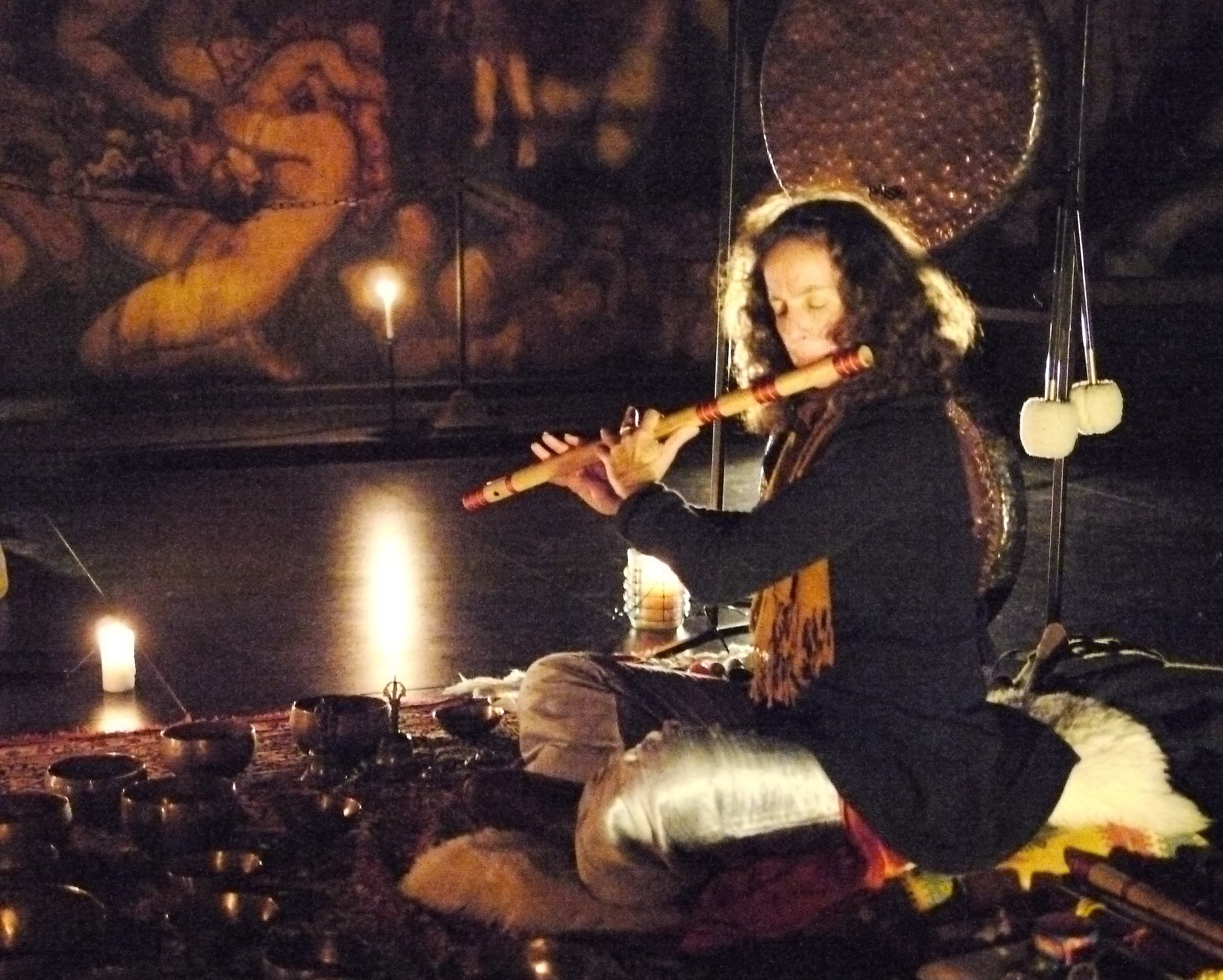Tal Zimra Coleman playing bansuri by candlelight